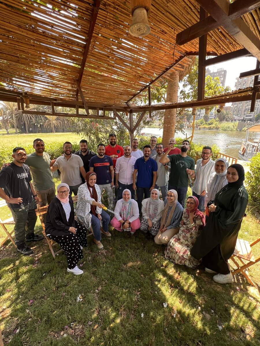 Educatly team gathered outdoors by the Nile during an InJoy training day